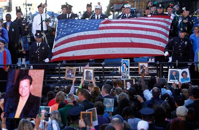 A flag from the World Trade Center is unfurled